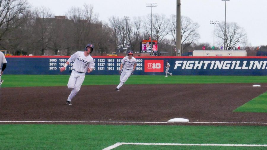 Sophomore infielder Justin Janas rounds third base in a game against Northwestern on March 27 at Illinois Field.
