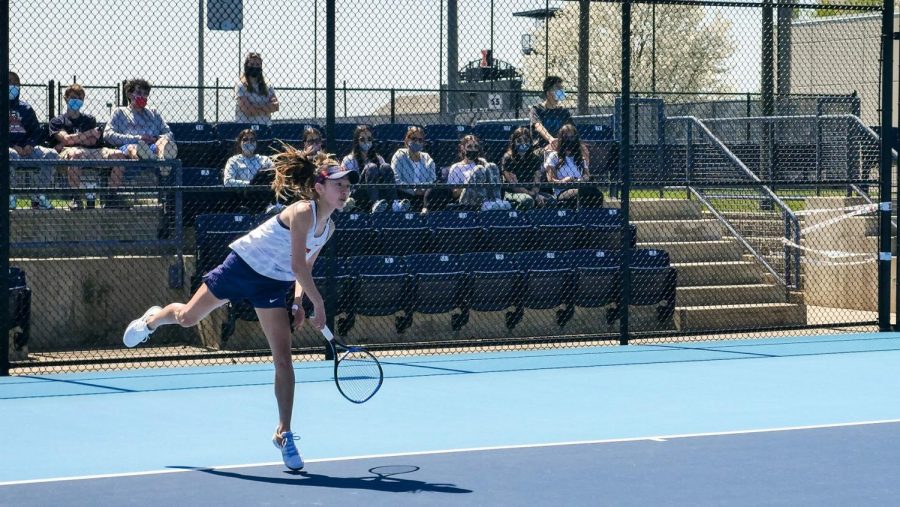 Senior Emilee Duong swings at the tennis ball during their match on April 9 against Michigan. The Womens Tennis team celebrates finishing their regular season by beating Northwestern. 
