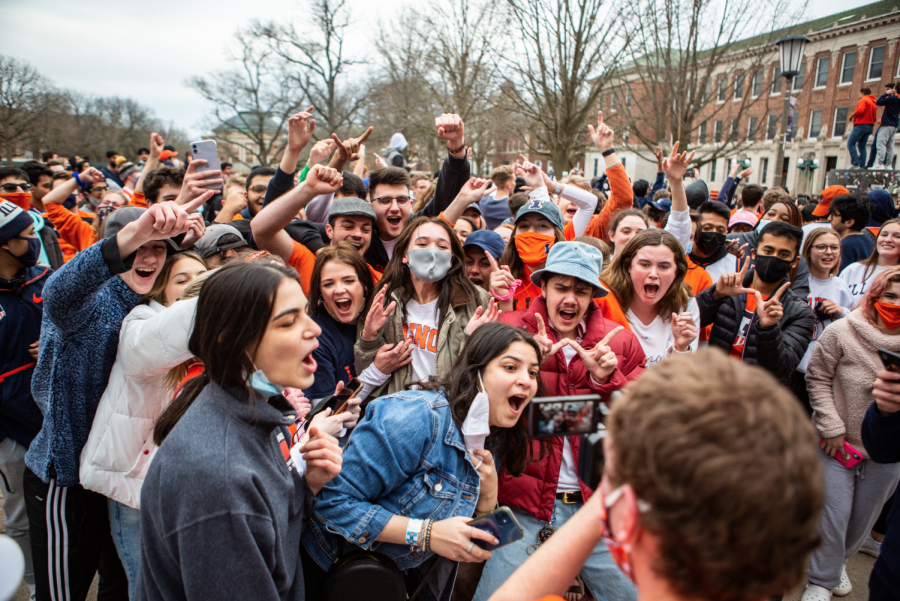 A group of University students crowd around a videographer on the Main Quad after the Illini basketball team won the Big Ten Championship on March 14. Columnist Nick Johnson argues that Illini basketball fans shouldnt be worried for next season because Brad Underwood is prepared to build another winning team.