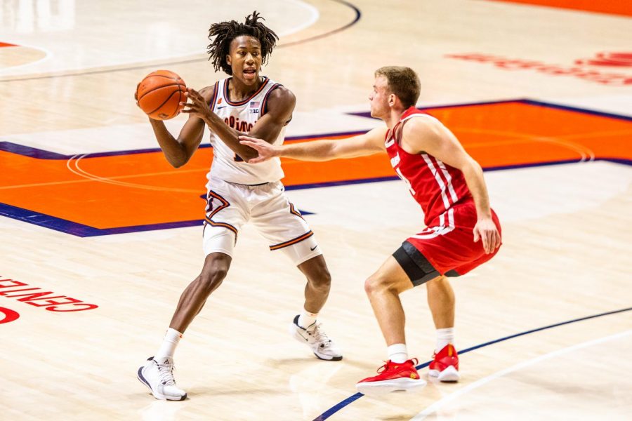 Junior Ayo Dosunmu looks for an open pass opportunity at the game against Wisconsin Feb. 6. The Daily Illini named Dosunmu the best men’s player of the year.