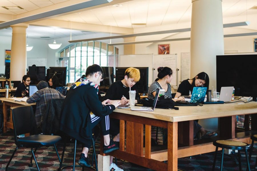 Students study for finals on the first floor of Grainger Library on May 6, 2019. Columnist Samuel Rahman argues that semester finals need to be updated.
