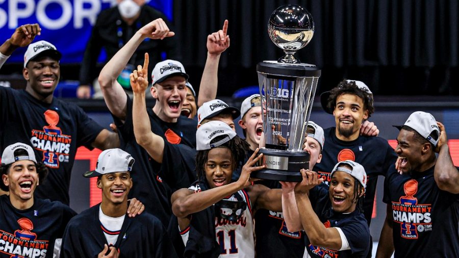 The men’s basketball team celebrates their big ten championship win on March 14.