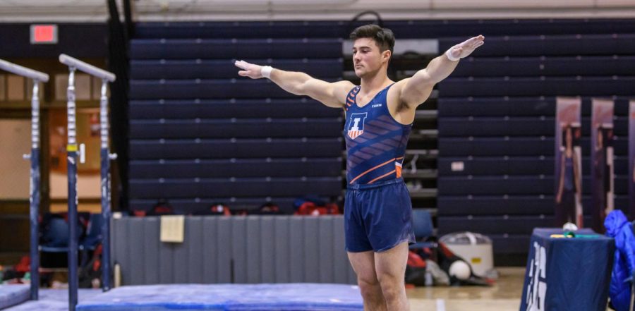 Junior Clay Mason Stephens poses for judges at a meet. The Illinois gymnast will compete on Friday for a spot in the next Olympics.