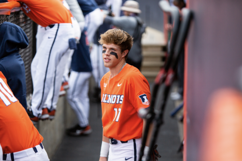 Justin Janas walks through the dugout during the game against Purdue April 18. Five players from the Illini baseball team will made the All-Big Ten team this season.