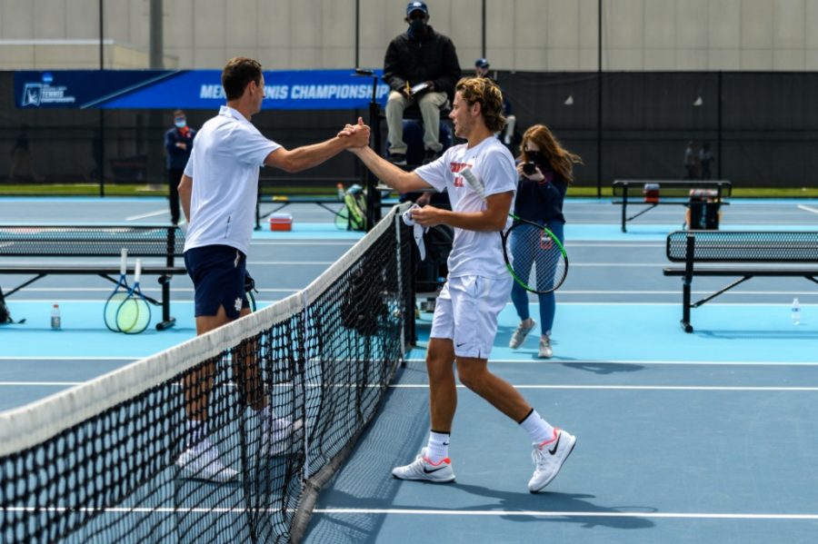 Senior Aleks Kovacevic shakes hands with another player during their game against Notre Dame May 8.  Aleks Kovacevic, Siphosothando Montsi and Zeke Clark will enter the NCAA singles competition.