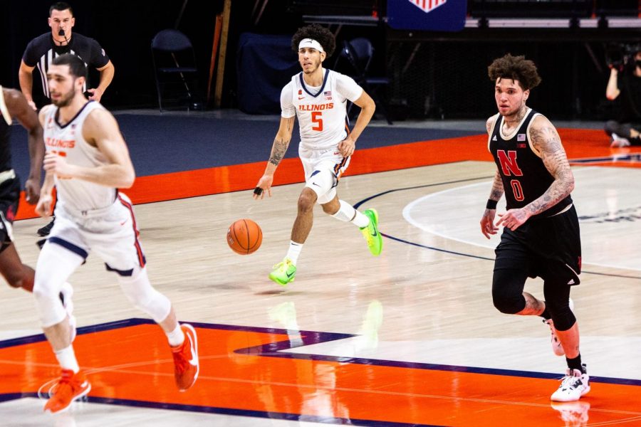 Freshman Andre Curbelo dribbles the basketball down the State Farm Center court Feb. 25 against Nebraska. Curbelos top moments from this season are played back. 