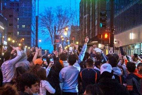 Students rush to the streets after the Illinois Basketball team won the Big Ten Tournament on March 14. The energy at Illinois creates a united culture unlike any other campus. 