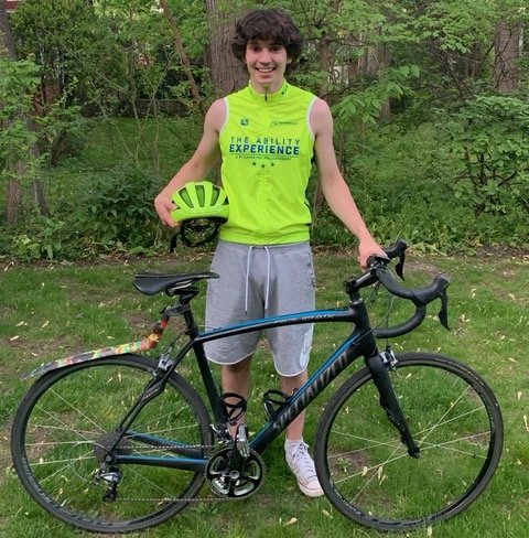 Nicholas Colegrove, sophomore in LAS, stands in front of the bike he will be riding across the country this summer. Colegrove will be raising awareness for people with disabilities who face isolation in partnership with the The Ability Experience’s Journey Of Hope.