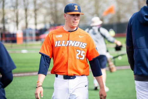 Illinois pitcher Nathan Lavender stands near the dugout prior to the game against Purdue on April 18. Lavender and teammate Andrew Hoffmann were selected in the 2021 MLB Draft.