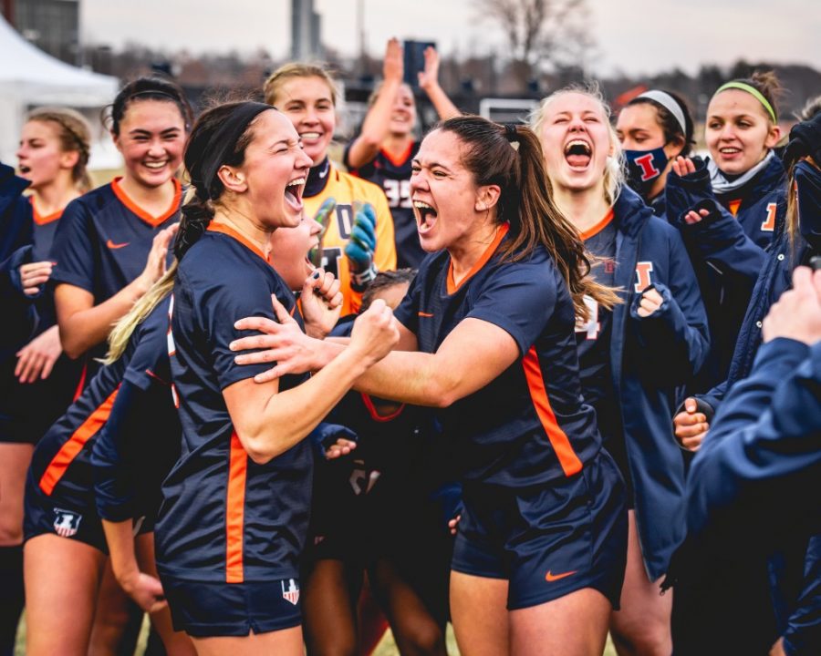 Part of the Illinois womens soccer team celebrates during the game against Iowa on Feb. 25. The 2021 roster looks promising for a successful season.