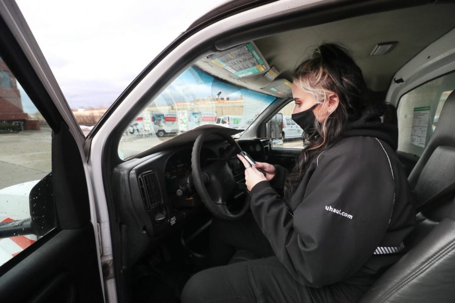Gabrielle McCaffrey checks the mileage on a U-Haul at the Cuyahoga Falls U-Haul Moving and Storage on Jan. 10. The U-Haul company has caused Illinois students much stress after canceling rentals. 