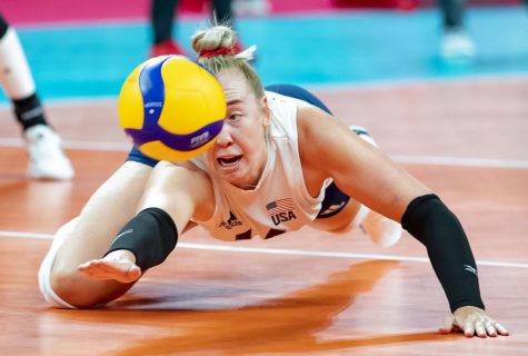 Former Illini Michelle Bartsch-Hackley dives to save the ball July 27 during the Tokyo Olympics. All eight former Illini at the Olympics have been working hard.