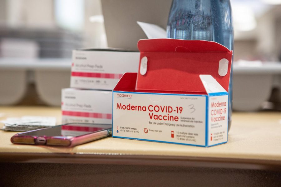 A Moderna Covid-19 Vaccine box sits on a table on Feb. 22. Select individuals will now be allowed to get a third does of the vaccine.