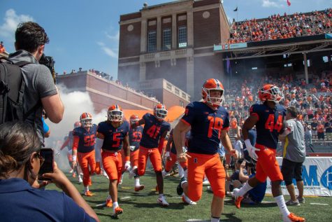 The Illinois football team runs out onto the field for the first quarter against Nebraska on Aug. 28.