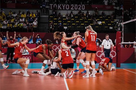 The USA Womens Volleyball Team celebrates a victory against the Brazil team. The USA Womens Volleyball Team won gold on Aug. 8. 