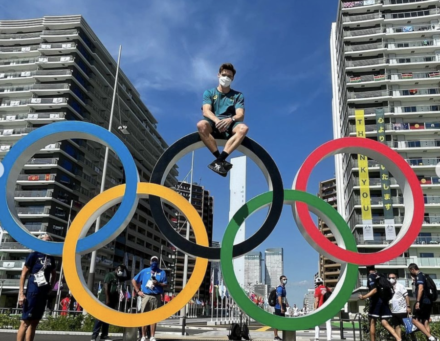 Former Illini Tyson Bull sits atop the Olympic rings in Tokyo before heading home to Australia. Bull finished his Olympic debut in fifth-place in the horizontal bar.