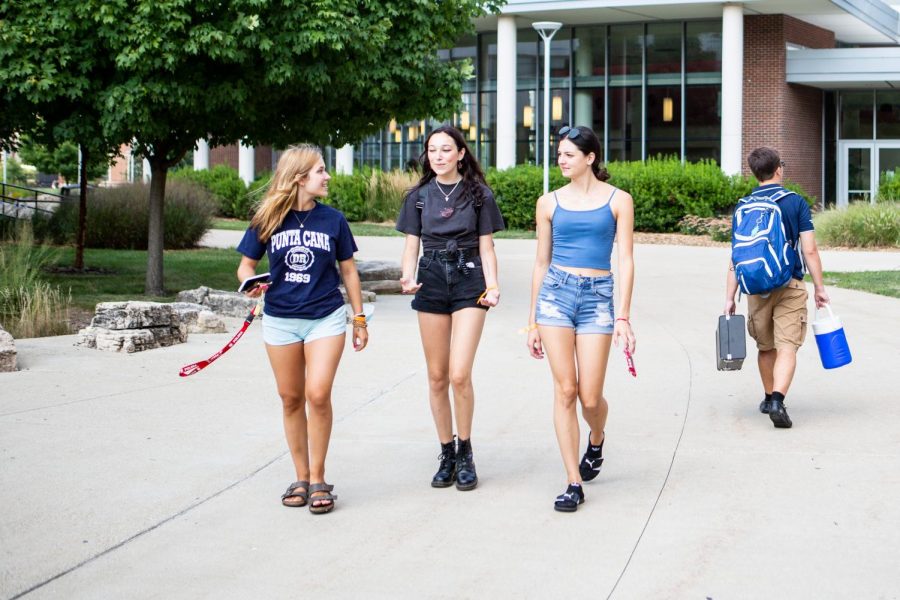 Three students walk outside of Ikenberry Commons on Aug. 20. There are multiple spots on campus that are easily enjoyed by new students. 