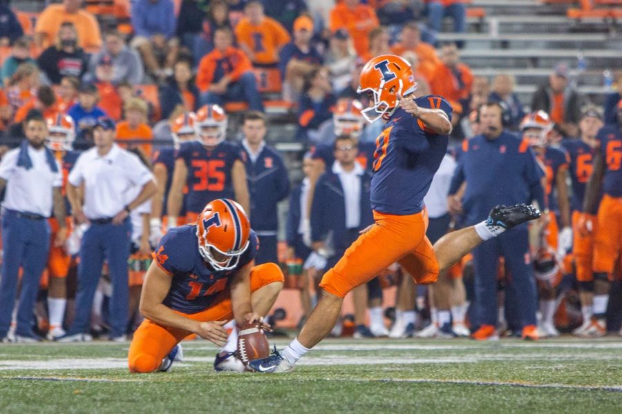 Kicker James McCourt begins to punt a football during the game against UTSA Sept. 4. The Illini hope to end their losing streak this weekend as they are prepared to play Charlotte on Saturday.