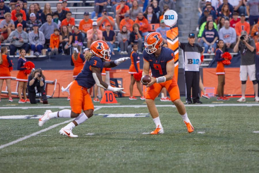 Art Sitkowski (9) hands the ball off to Jakari Norwood (3) in the first half during the game against the University of Texas at San Antonio at Memorial Stadium on Saturday.