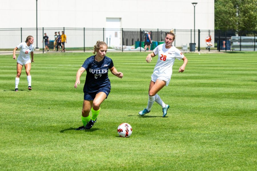 Freshman midfielder and Georgia transfer Sydney Stephens attempts to steal the ball from her opponent during a game against Butler on Aug. 29. Stephens has settled quickly into the Universitys soccer program.