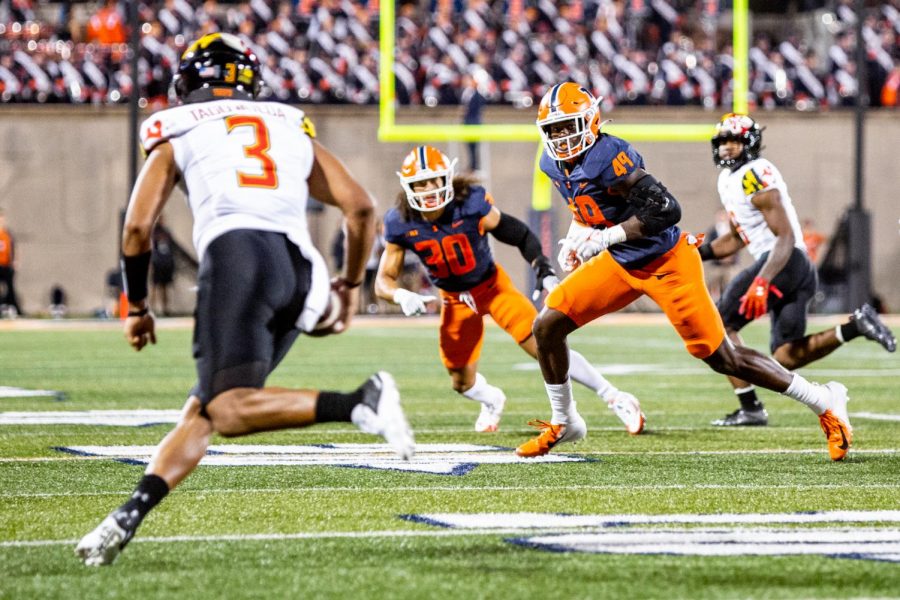 Offensive+linebacker+Seth+Coleman+runs+to+tackle+his+Maryland+opponent+during+the+game+Sept.+17.+The+Daily+Illini+sports+staff+makes+predictions+as+to+how+the+game+against+Purdue+will+play+out.