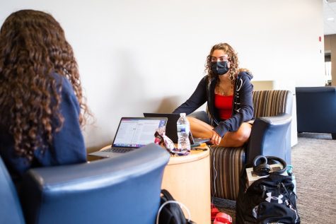 Nora Rafaty and Hulya Goodwin, students in LAS, study in the upstairs lounge of Ikenberry Commons on Sept. 18 while wearing masks. Many students share a concern with COVID-19 being spread around in-person classes.