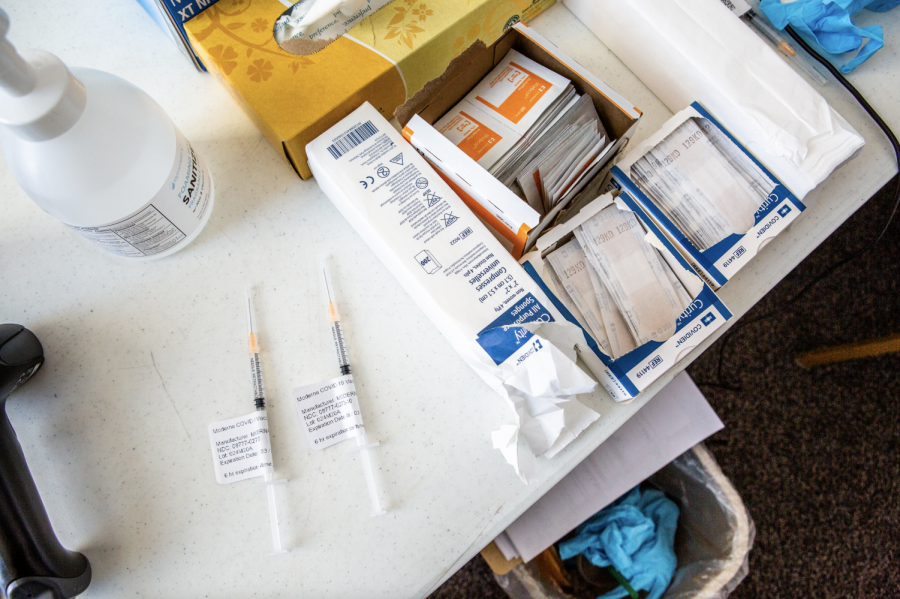 A syringe filled with the Moderna vaccine sits beside boxes of bandages and wipes at the Church of the Living God on Feb. 20. The deadline to be begin the vaccination process at the University was Sept. 16, yet the undergrad vaccination rate is at 91%.