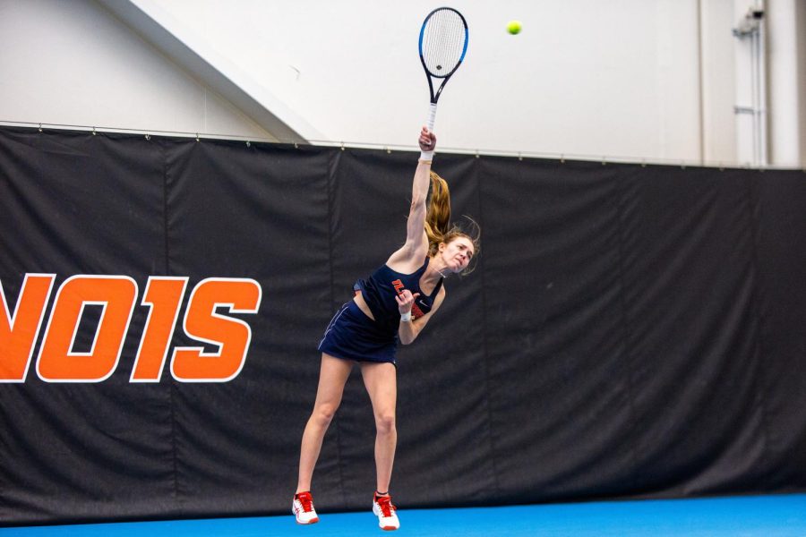 Josie Frazier serves the ball during the tennis match against Wisconsin Feb. 26. The womens team will compete at the ITA Midwest Super Regional hosted by Ohio State later this week.