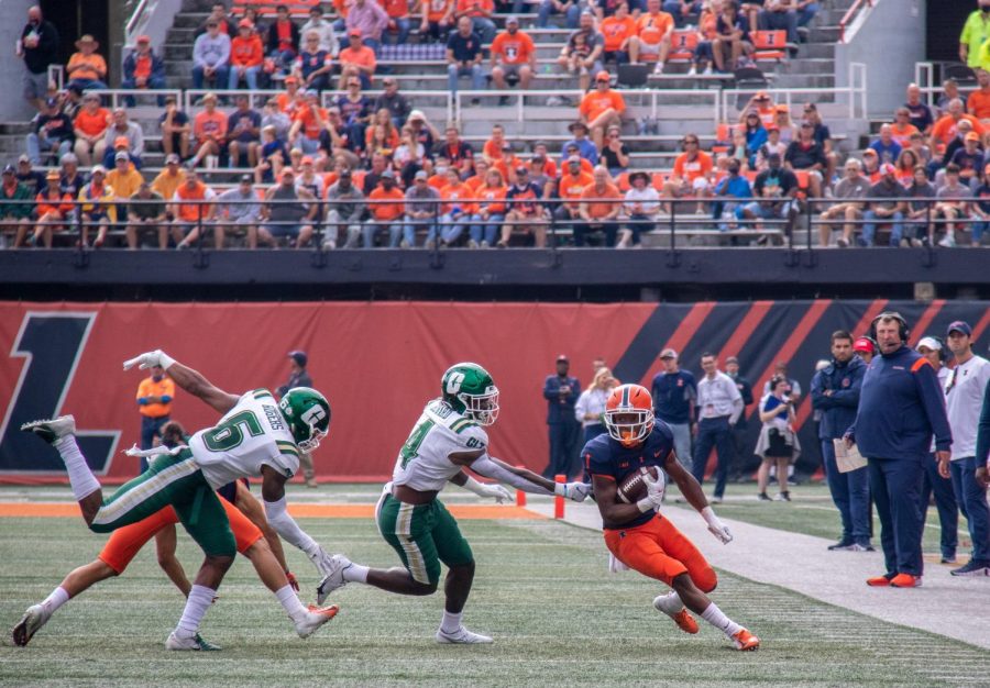 Isaiah Williams catches the ball during the game against Charlotte on Saturday at Memorial Stadium. The Illini took down the 49ers, 24-14, to snap the teams four-game losing streak ahead of Homecoming next weekend.
