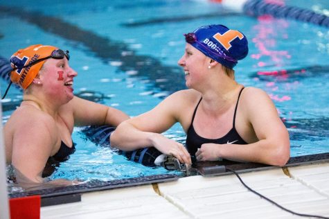 Lauren Partridge and Cara Bognar chat during Illinois Orange and Blue meet on Oct. 9. The Illini beat Southern Illinois and Illinois State on Friday before falling to Vanderbilt on Saturday. 