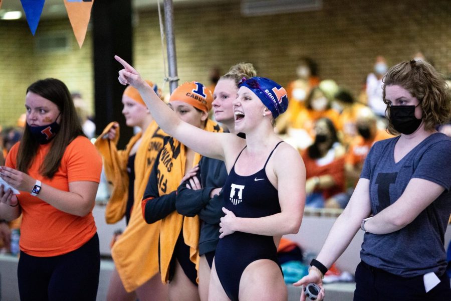 Sophomore+Cara+Bognar+cheers+on+her+teammates+during+the+Orange+and+Blue+meet+at+the+ARC+Oct.+9.+The+Illinois+women%E2%80%99s+swim+%26+dive+team+went+2-1+after+facing+off+in+a+tri-meet+against+Northwestern+and+UIC.