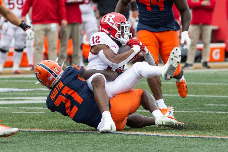 Illinois defensive back Jartavius Martin makes a tackle during the game against Rutgers on Saturday at Memorial Stadium. Though Brandon Peters bounced back in his return and the defense had a solid game overall, the Illinis inability to get the run game going cost them, falling 20-14 to the Scarlet Knights.