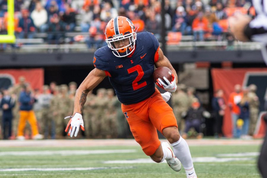 Chase+Brown+carries+the+ball+during+Illinois+20-14+loss+to+Rutgers+at+Memorial+Stadium+on+Saturday.+The+Illini+never+got+the+run+game+going+despite+a+solid+performance+from+quarterback+Brandon+Peters.