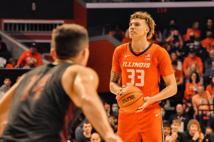 Coleman Hawkins collects himself before shooting a 3-pointer during the game against Indiana Unversity at Pennsylvania on Friday at State Farm Center. Hawkins scored 16 points and made his first career start in the Illinis 94-79 win.