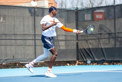 Senior Kweisi Kenyatte hits the ball during a match against Minnesota on April 4. The Illinois mens tennis team performed well at the ITA Midwest Regionals this past weekend. 