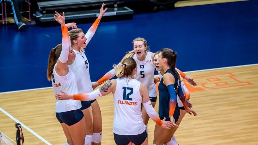 Illini Volleyball team huddles and celebrates during the match against Indiana on Nov. 12. The Illini won against Indiana, 3-0, and will be up against Ohio State on Sunday. 