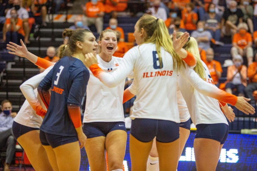 Megan Cooney celebrates with her teammates during Illinois match against Purdue on Oct. 6 at Huff Hall. The Illini will face West Virginia in the first round of the NCAA tournament this weekend.