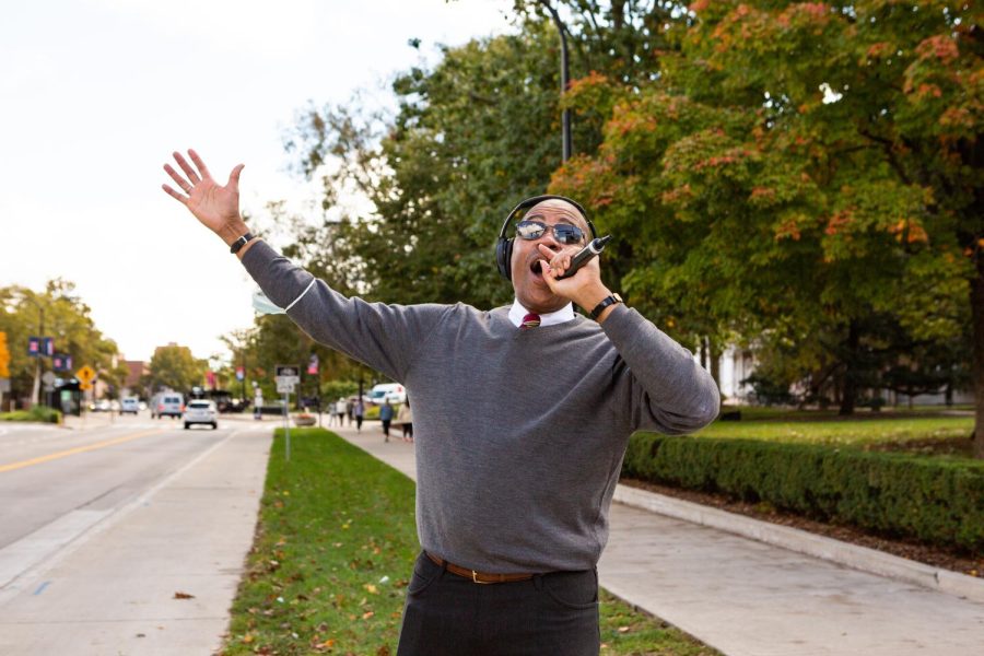 Reginald A. Stuckey, sociology professor at the University, raps on Green Street as a way to express himself creatively.