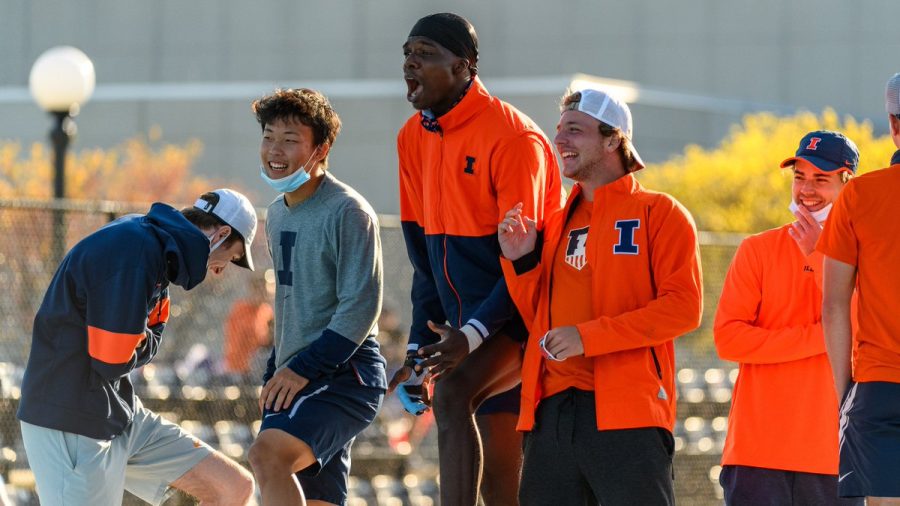 Hunter Heck, Kweisi Kenyatte, Alex Pretrov, and Nic Meister cheer for a fellow teammate at the Big Ten Singles and Doubles Championships. The Illinois mens tennis team ended their fall season with success.