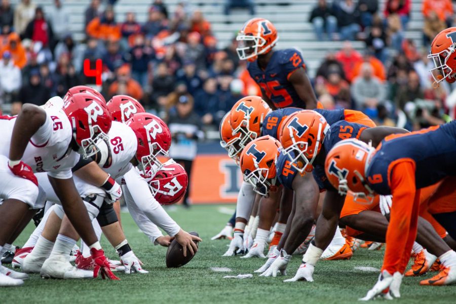 The Illinois offensive lines  waits for the Wisconsin quarterback to throw the ball on Oct. 30. The Daily Illini predicts how the team will perform against Iowa this weekend.