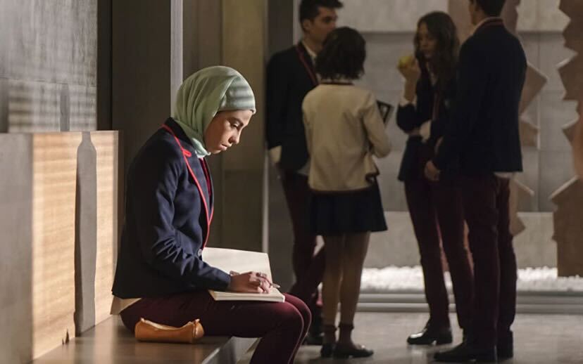 A scene from the Netflix show Elite of a Muslim character, Nadia Shanaa, who is played by Mina El Hammani. Columnist  Chiara Awatramani believes that western media misrepresents Muslims and Islam culture. 