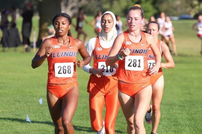Junior runner, Olivia Howell (288), runs with teammates Sam Poglitsch (281) and Ayah Aldadah at the ISU Red Bird Invite on Sept. 17. Howell has a consistent and successful season as being a top finisher in her races.