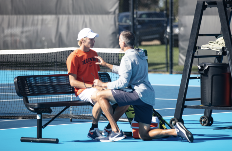 Illinois mens tennis head coach Brad Dancer talks to Gabrielius Guzauskas during the Illini Invite Oct.  17. The team aims to end their fall season on a high note. 