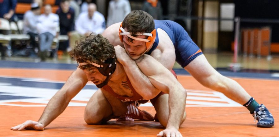 Redshirt sophomore Zac Braunagel wrestles his opponent to the mat. Illinois had a solid performance with eight Illinois wrestlers earning top-six finishes at the Michigan State Open this weekend.