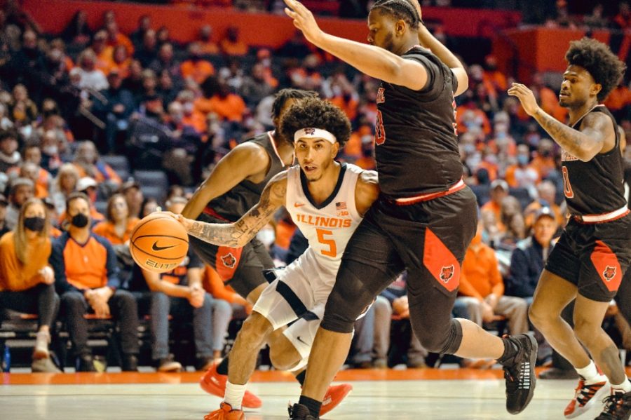 Andre Curbelo drives to the basket during Illinois 92-53 win over Arkansas State on Friday night. High energy on both ends of the court proved pivotal in the Illinis blowout win.