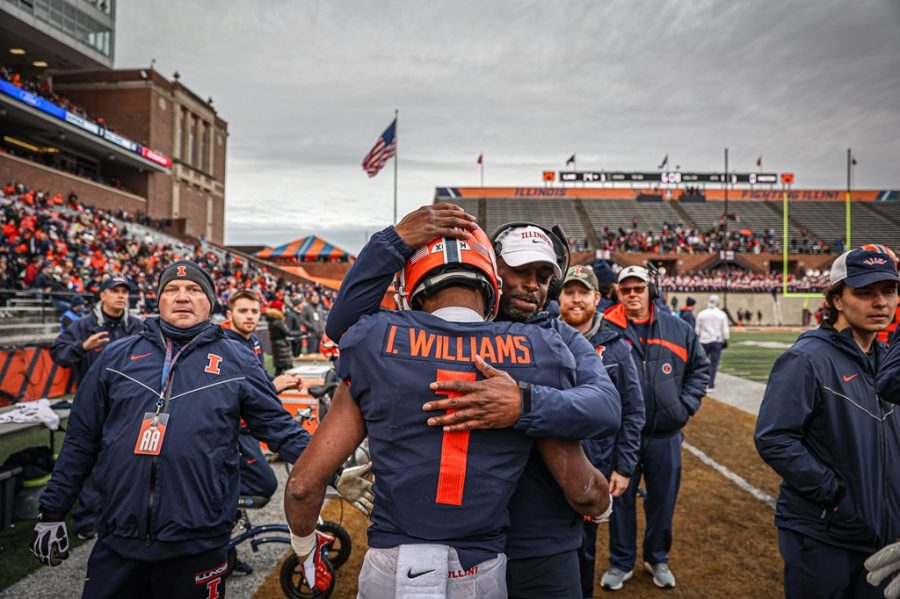 Wide+receiver+Isaiah+Williams+embraces+a+coach+during+the+game+against+Northwestern+on+Saturday.+The+Illini+made+a+series+of+good+plays+during+the+game+to+bring+them+to+victory.
