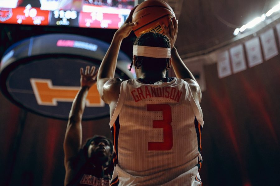 Jacob Grandison attempts a pass during the game against Arkansas State on Friday at State Farm Center. The team is now making their way north to compete against Marquette for the annual Gavitt Tipoff Games.