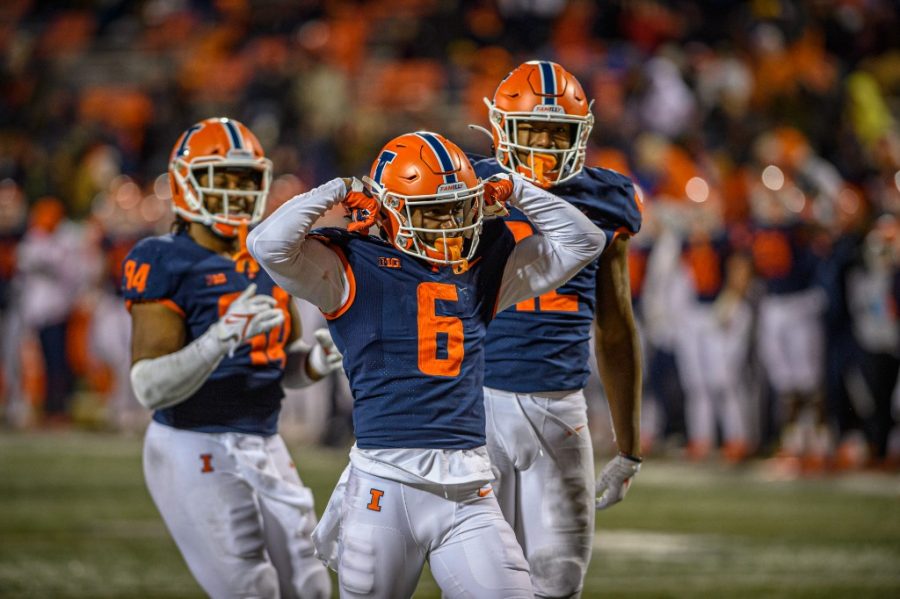 Illinois defensive back Tony Adams flexes in celebration during Illinois 47-14 win over Northwestern on Saturday. Adams and the Illini defense dominated, forcing two turnovers while allowing just 14 points in the emphatic win.
