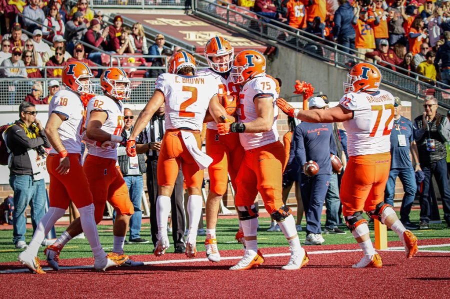 Illinois+celebrates+after+tight+end+Tip+Reiman+scores+his+first+career+touchdown+on+Saturday+against+Minnesota.+The+Illini+beat+the+No.+20+Golden+Gophers%2C+14-6%2C+behind+a+dominant+defensive+display.