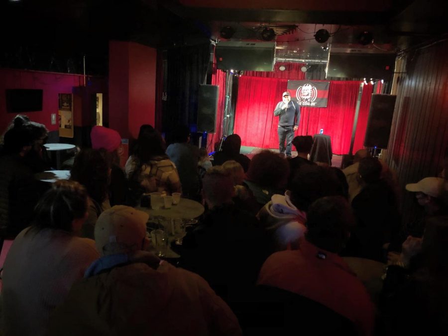 A person performing stand up during the Canopy Clubs Open Mic Comedy. The Open Mic Comedy occurs every Monday and open to any one. 